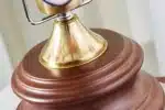 Vintage desk lamp with stained glass butterfly shade casting warm glow on bedside table