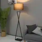 Modern floor lamp with iron frame and fabric shade in a contemporary living room