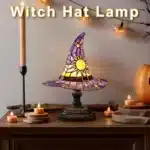Witch hat lamp with stained glass pattern casting a warm glow on a bedside table