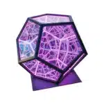 Dodecahedron gaming light with vibrant RGBW colors illuminating a gaming desk setup