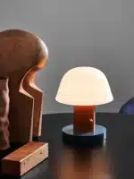 Nordic retro mushroom table lamp with warm LED glow on a bedside table