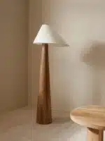 Conical oak floor lamp with wabi-sabi style in a cozy living room