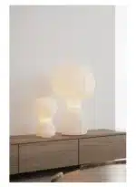 Wabi sabi floor lamp with textured fabric shade in a cozy living room corner