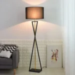 Modern floor lamp with iron frame and fabric shade in a contemporary living room