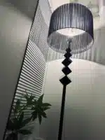 Modern crystal floor lamp with black finish and LED light in a living room
