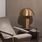 Modern mushroom table lamp with metal shade and wood base on bedside table