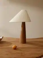 Conical oak floor lamp with wabi-sabi style in a cozy living room