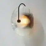 Modern wall lamp with minimalist Nordic design illuminating a cozy bedroom bedside
