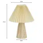 Handmade rattan bedside lamp with pleated shade on vintage nightstand