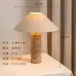 Modern marble LED table lamp with white fabric shade on wooden desk