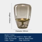 Modern table lamp with glass shade on bedside table