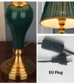 Green ceramic table lamp with European cloth shade in a modern living room setting