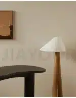 Conical oak floor lamp with wabi-sabi style in a cozy living room