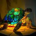 Colorful stained glass animal lamp featuring a cat design, glowing warmly on a bedside table