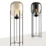 Modern floor lamp with iron frame and glass shade in a cozy living room
