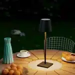 Cordless USB rechargeable table lamp with touch switch on a patio table