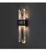 Rustic wall sconce with Edison bulb illuminating a modern loft bedroom
