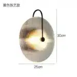Modern wall lamp with minimalist Nordic design illuminating a cozy bedroom bedside