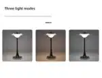 Goldoma rechargeable table lamp with flying saucer shape and warm glow on a bedside table