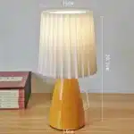 Milkshake bedside table lamp with warm LED light on a nightstand in a cozy bedroom