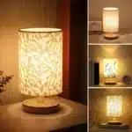 Modern linen table lamp with USB port and touch control on bedside table