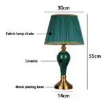 Green ceramic table lamp with European cloth shade in a modern living room setting