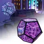 Dodecahedron gaming light with vibrant RGBW colors illuminating a gaming desk setup