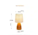 Milkshake bedside table lamp with warm LED light on a nightstand in a cozy bedroom