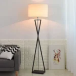 Modern floor lamp with iron frame and fabric shade in a contemporary living room
