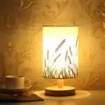 Modern linen table lamp with USB port and touch control on bedside table