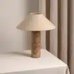 Modern marble LED table lamp with white fabric shade on wooden desk