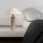 Modern marble LED table lamp with white fabric shade on wooden desk