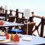 Cordless USB rechargeable table lamp with touch switch on a patio table
