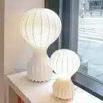 Wabi sabi floor lamp with textured fabric shade in a cozy living room corner