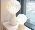 Wabi sabi floor lamp with textured fabric shade in a cozy living room corner