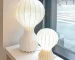 Wabi sabi floor lamp with textured fabric shade in a cozy living room corner