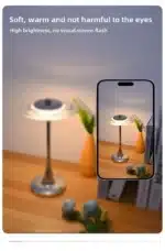 Goldoma rechargeable table lamp with flying saucer shape and warm glow on a bedside table