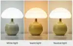 Mushroom table lamp with cream ceramic shade on bedside table