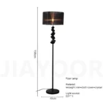 Modern crystal floor lamp with black finish and LED light in a living room