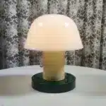 Nordic retro mushroom table lamp with warm LED glow on a bedside table