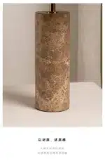 Modern marble LED table lamp with white fabric shade on wooden desk