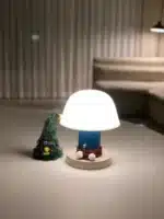 Nordic retro mushroom table lamp with warm LED glow on a bedside table