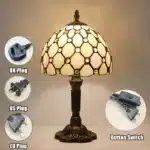 Vintage table lamp with handmade colored glass shade casting warm ambient light