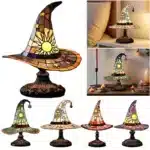 Witch hat lamp with stained glass pattern casting a warm glow on a bedside table