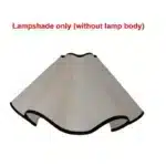 Elegant handmade petal lampshade casting a warm glow in a cozy bedroom