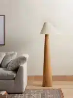 Conical oak floor lamp with wabi-sabi style in a cozy living room