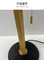 Modern bedside lamp with cream glass shade on a nightstand