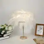 Ostrich feather table lamp glowing warmly on a bedside table in a cozy bedroom
