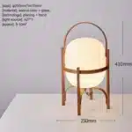 Modern table lamp with wood and glass base, minimalist design for bedroom or living room