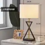 Modern floor lamp with iron frame and fabric shade in a contemporary living room